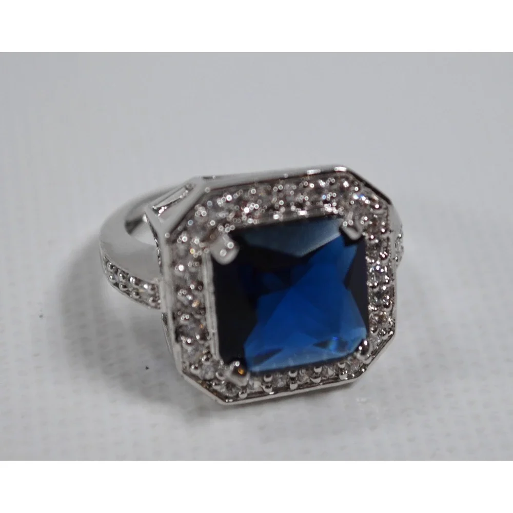Silver Tone Ring Sz 6.75 w/ Large Blue Setting Sounded By Tiny Clear Rhinestones